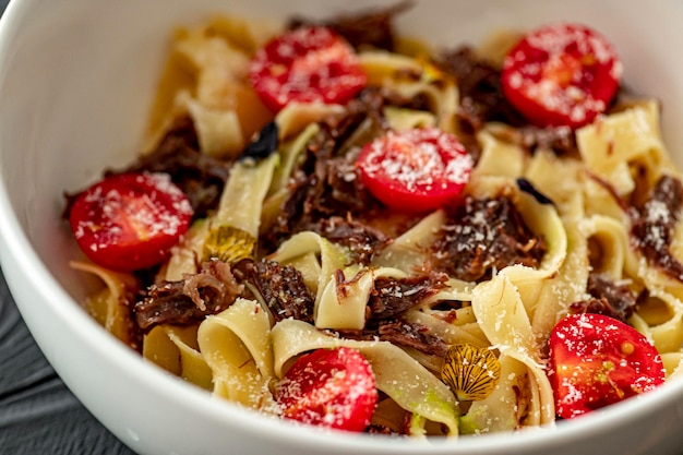 Tagliatelle with stewed veal with truffle paste cheri and parmesan Pasta with veal