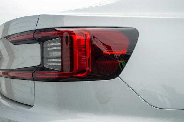 Tail Lights of a White Electric Car