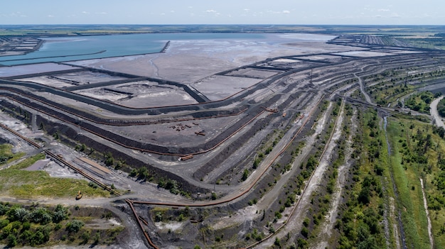 Tailings dump are the materials left over after the process of separating the valuable fraction from the uneconomic fraction gangue of an ore aerial view.