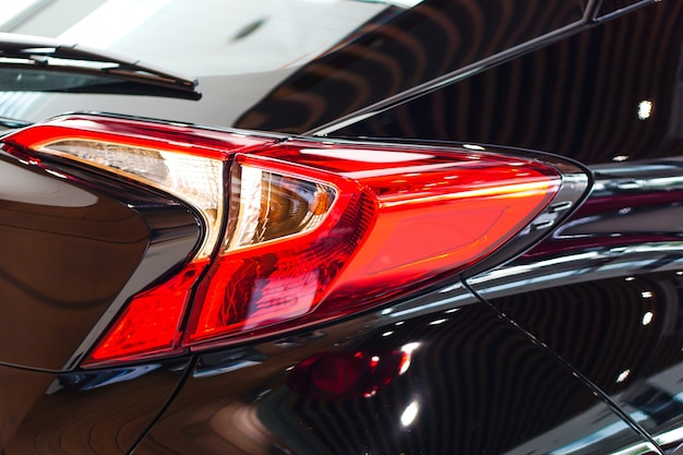 Taillight or rear light of new modern technology car in showroom