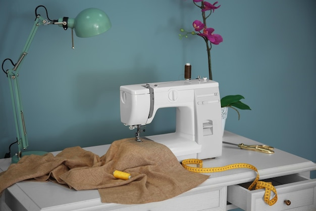 Tailor desk with modern sewing machine