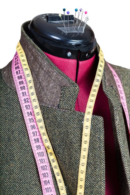 Tailoring of man tweed jacket on mannequin