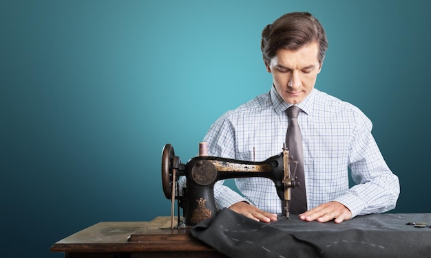 Premium Photo | Tailors at work. two confident tailors working at ...