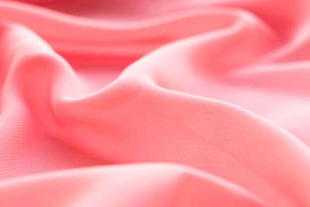 tails of coral pink silk fabric