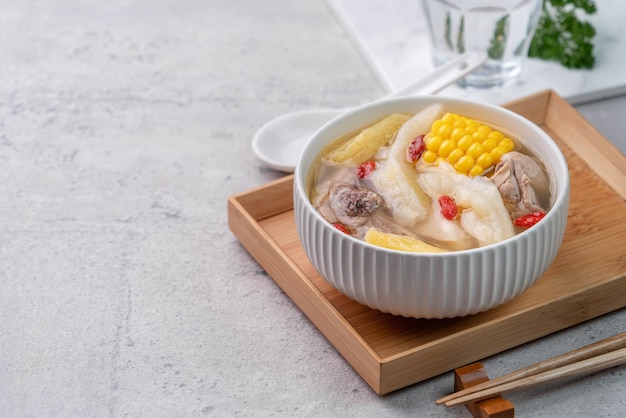 Photo taiwanese homemade delicious chicken soup with pineapple bitter gourd and sweet corn