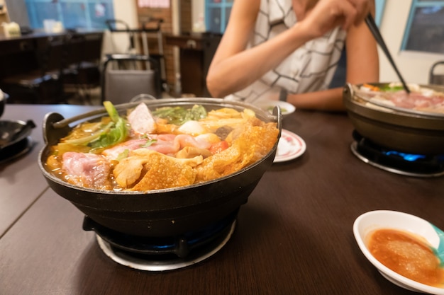 Taiwanese small hot pot with vegetables and meat at restaurant