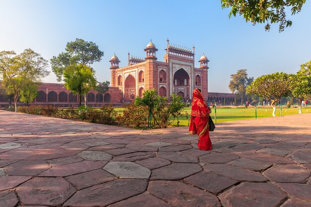 Taj Mahal East Gate and an Indian woman, India, Agra.