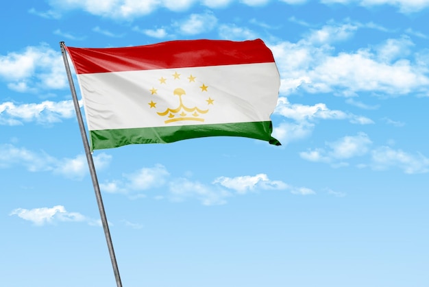 tajikistan 3D waving flag on a sky blue with cloud background image