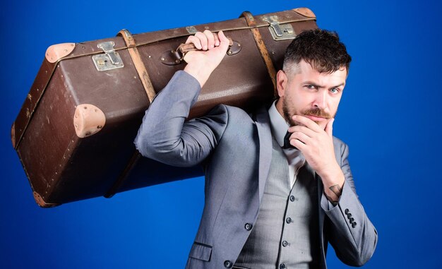 Take all your things with you Heavy suitcase Delivery service Travel and baggage concept Hipster traveler with baggage Baggage insurance Man well groomed bearded hipster with big suitcase