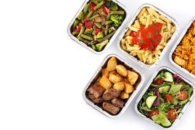 Take away healthy food in foil boxes isolated