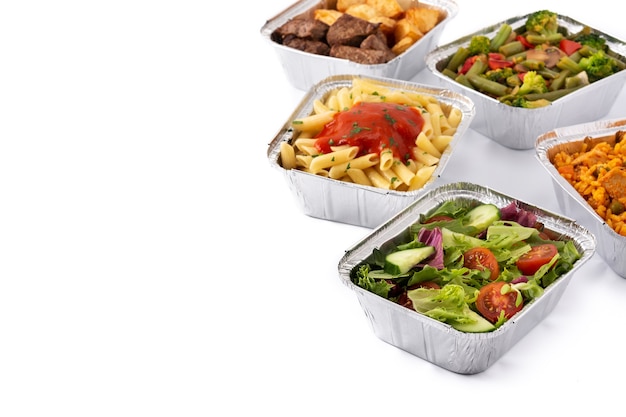 Take away healthy food in foil boxes isolated