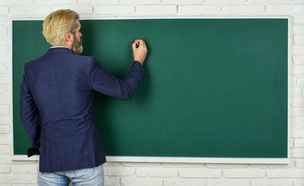 Take placement test Teacher wanted Teachers enlighten path of success Teacher explain topic Man teacher in front of chalkboard copy space Announcement of free courses Advertisement concept