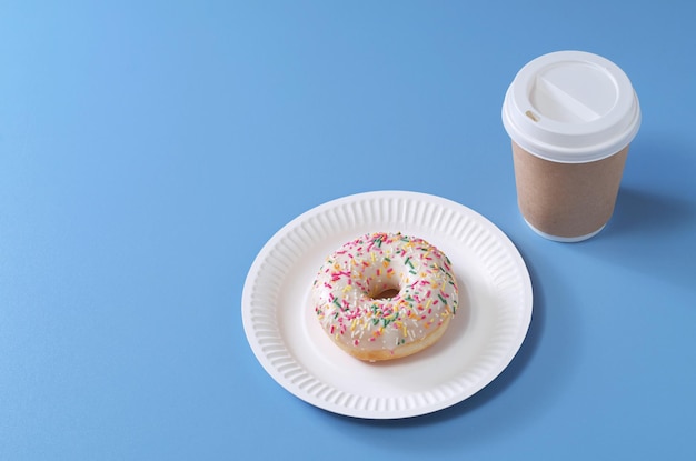 Takeaway coffee cup and donut