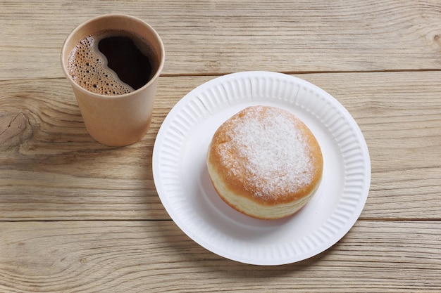 Takeaway coffee cup with donut