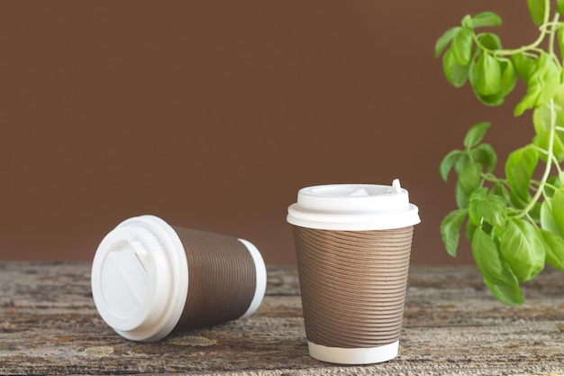 Takeaway paper coffee cup on cafe table