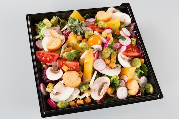 Takeaway salads container on white 