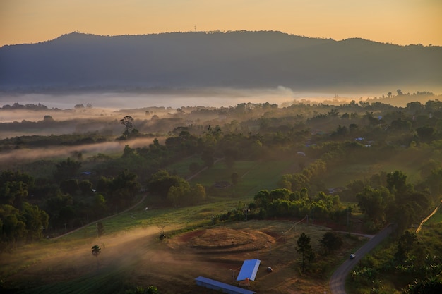 Takhian Ngo Mountain view with the sea of mist in the morning and twilight of sunrise