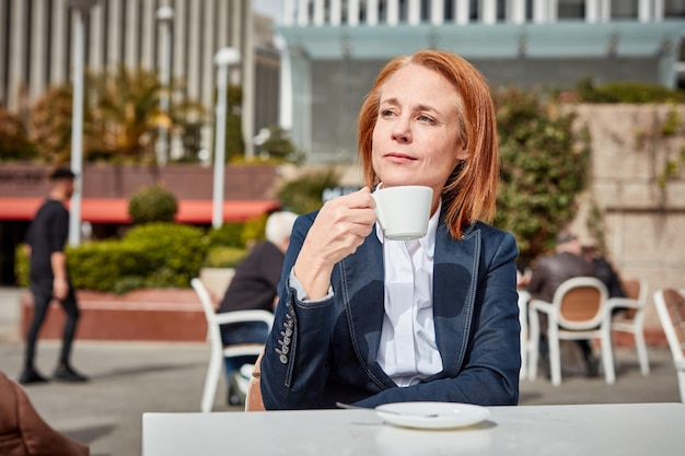 Taking a moment to recharge a successful middleaged businesswoman enjoys a peaceful coffee break