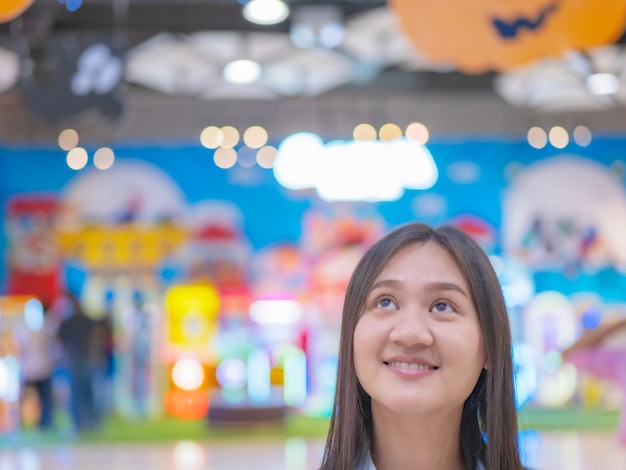 Taking photos of asian girls head shot wearing jeans in a
department store pretending to be thinking about what you want to
buy