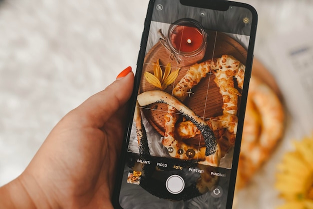 TAKING A PICTURE OF FRESH BREAD