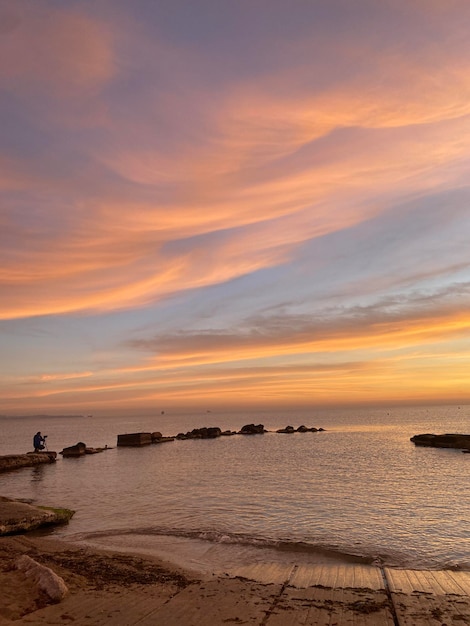 Taking pictures of the sunrise in the Mediterranean coast