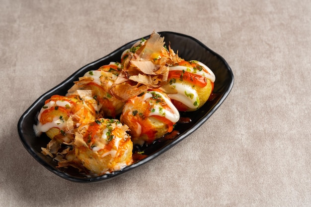 Takoyaki is a ballshaped Japanese snack made of a wheat flourbased batter and cooked in a special molded pan