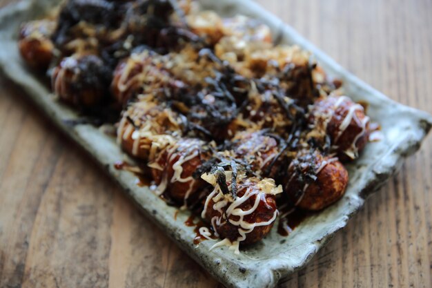 Takoyaki on wood background , japanese food