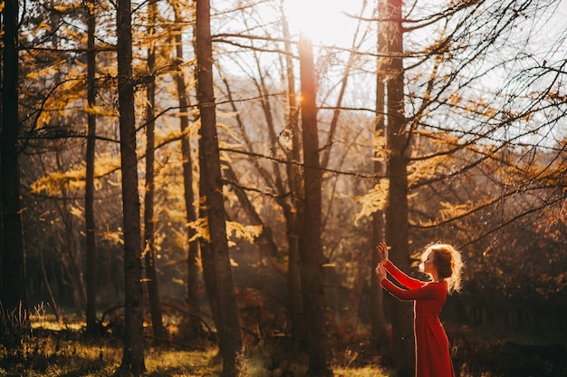 Photo tale. fantastic redhead girl in a mysterious forest