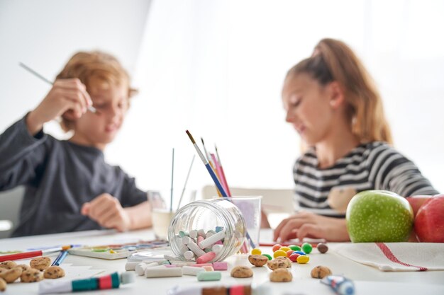 Talented Children Painting At Messy Table