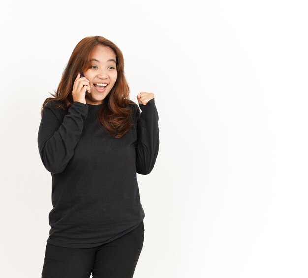 Talking or make call on Smartphone Of Beautiful Asian Woman Wearing Black Shirt Isolated On White