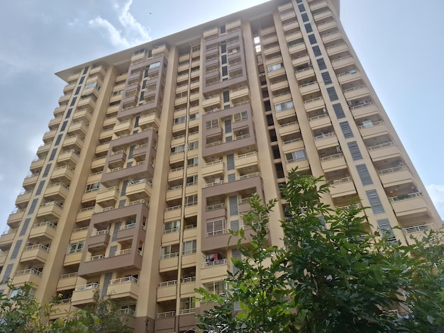 a tall building with balconies and a sign that says " apartment ".