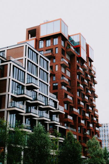 A tall building with balconies and windows Stock Photo