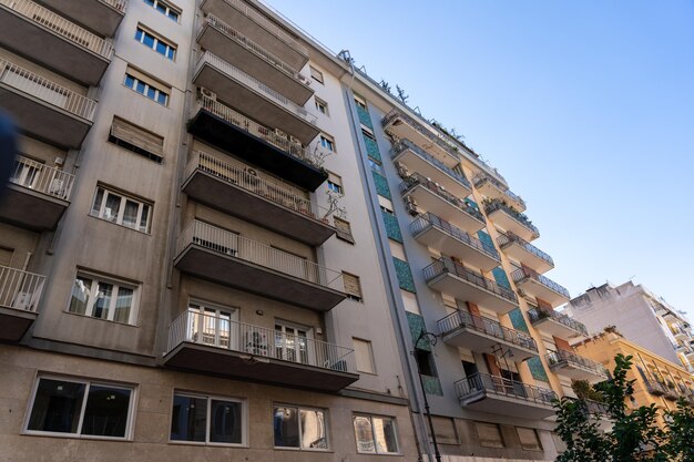 A tall building with balconies and windows