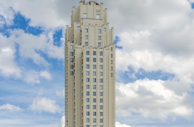 A tall building with a blue sky in the background