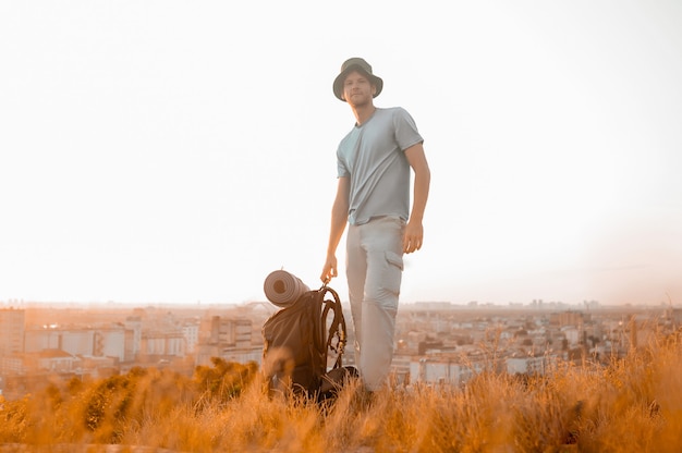 A tall man standing on the sky backgroubnd