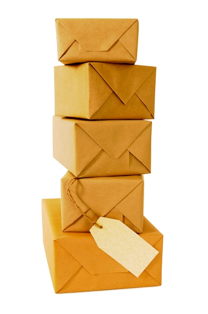 Tall stack of brown paper packages with label 