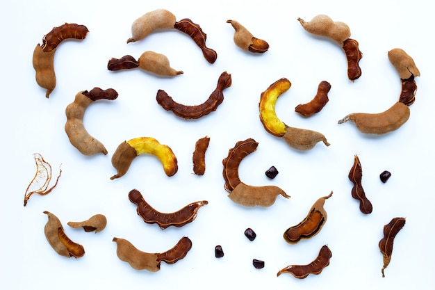 Tamarind tropical fruit on white wall Top view