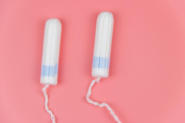 Tampons on a pastel pink background Top view