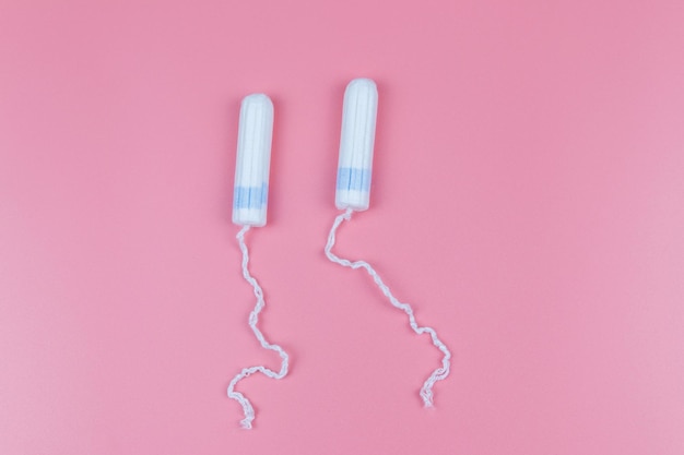 Tampons on a pastel pink background Top view