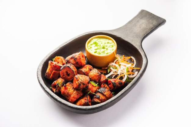 tandoori soya chaap or soy chap dish prepared by marinating in tandoori spices closeup view