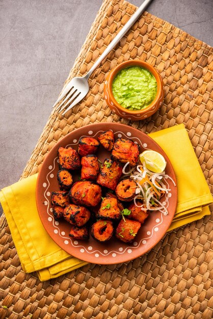 Tandoori soya chaap or soy chap dish prepared by marinating in tandoori spices closeup view