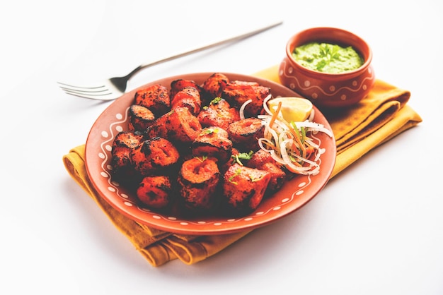 Tandoori Soya Chaap or soy chap dish prepared by marinating in tandoori spices closeup view