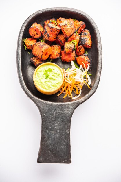 tandoori soya chaap or soy chap dish prepared by marinating in tandoori spices closeup view
