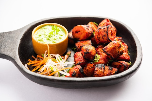 tandoori soya chaap or soy chap dish prepared by marinating in tandoori spices closeup view