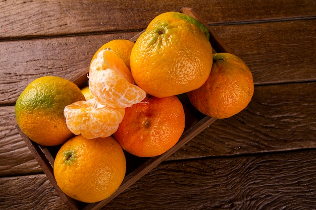 Tangerine box on wooden table