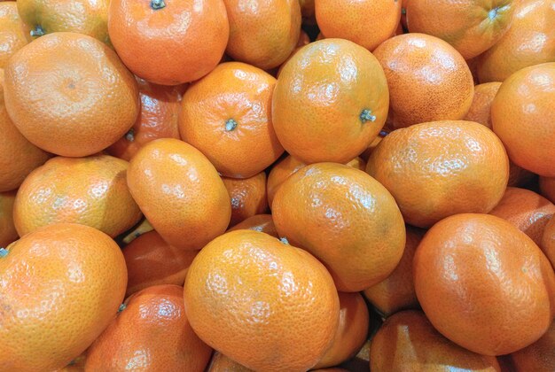 Photo tangerine fruits in a grocery store