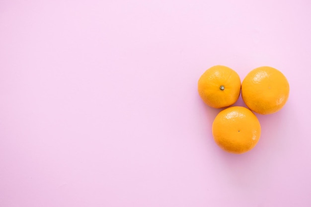 Tangerine orange on a pink background