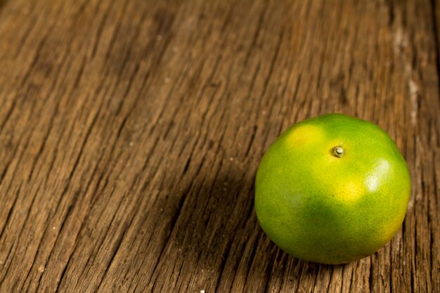 Tangerine. sweet orange. on wooden. texture wooden