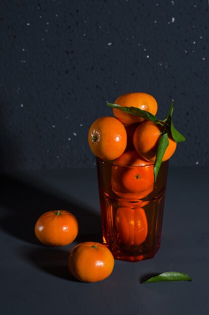 Photo tangerines on a black background