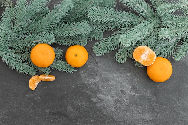 Tangerines among the branches of pine and cones New Year39s entourage